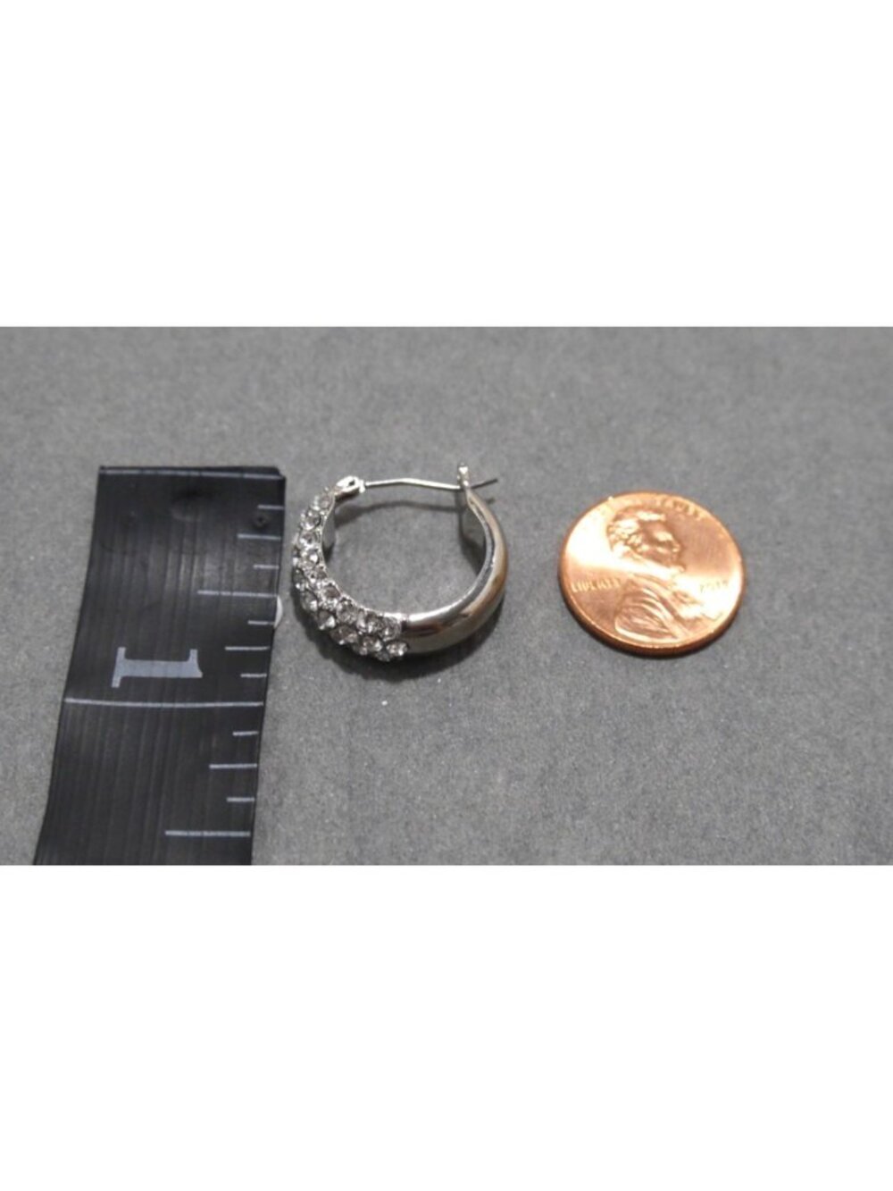 Silver tone hoop earrings with clear stones approx 3/4" long - Picture 2 of 3